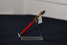 Attractive, sleek, slimline style acrylic pen body with gold plated metal;  the pen uses a Cross refill.